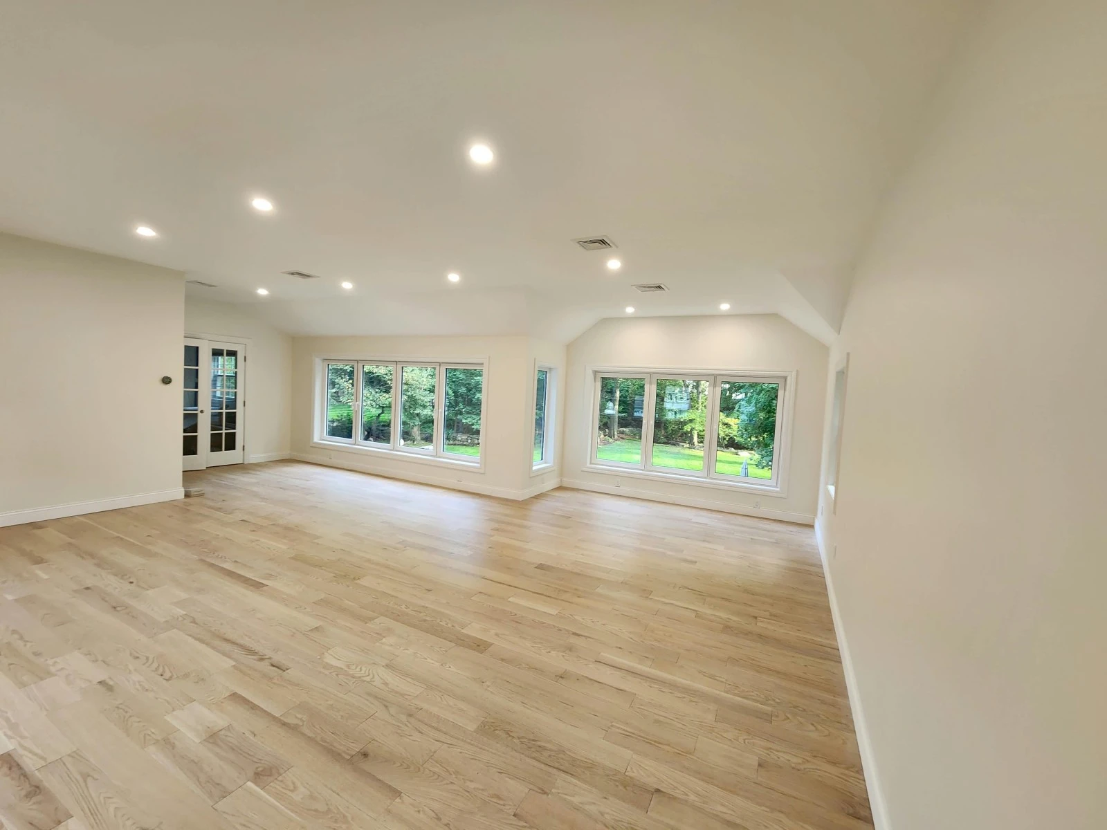 Finished family room addition in Stamford CT with large windows